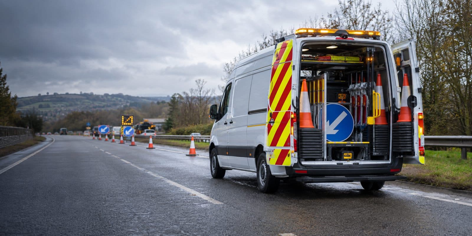 Traffic management vehicle with chevrons and organised equipment at UK roadworks